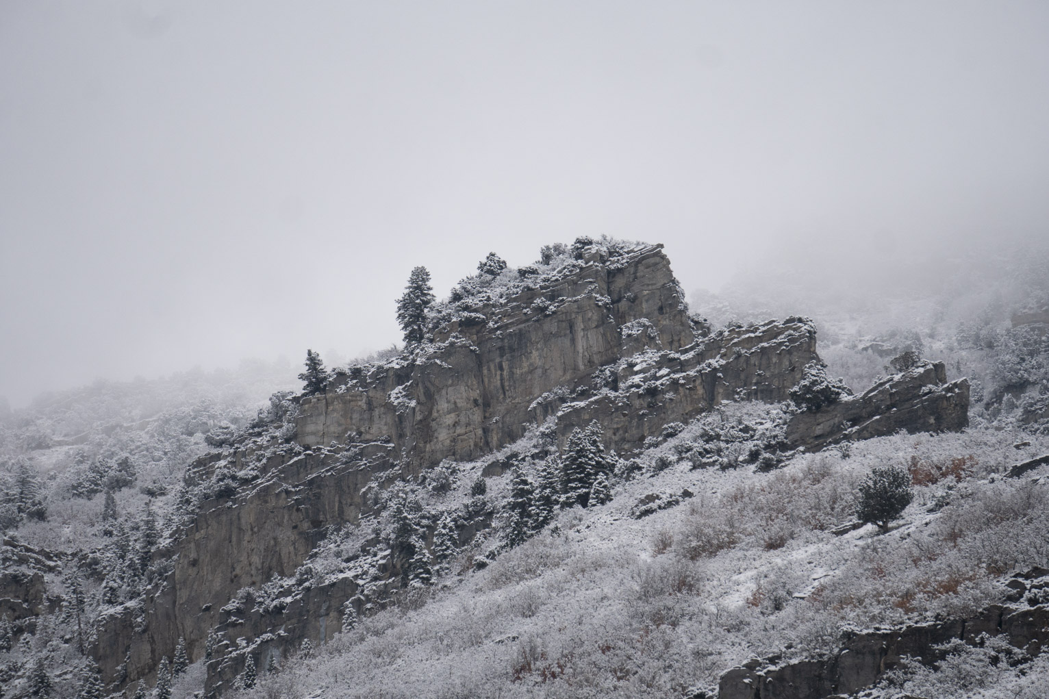 Recent snowfall up on some rocks further up the mountainside